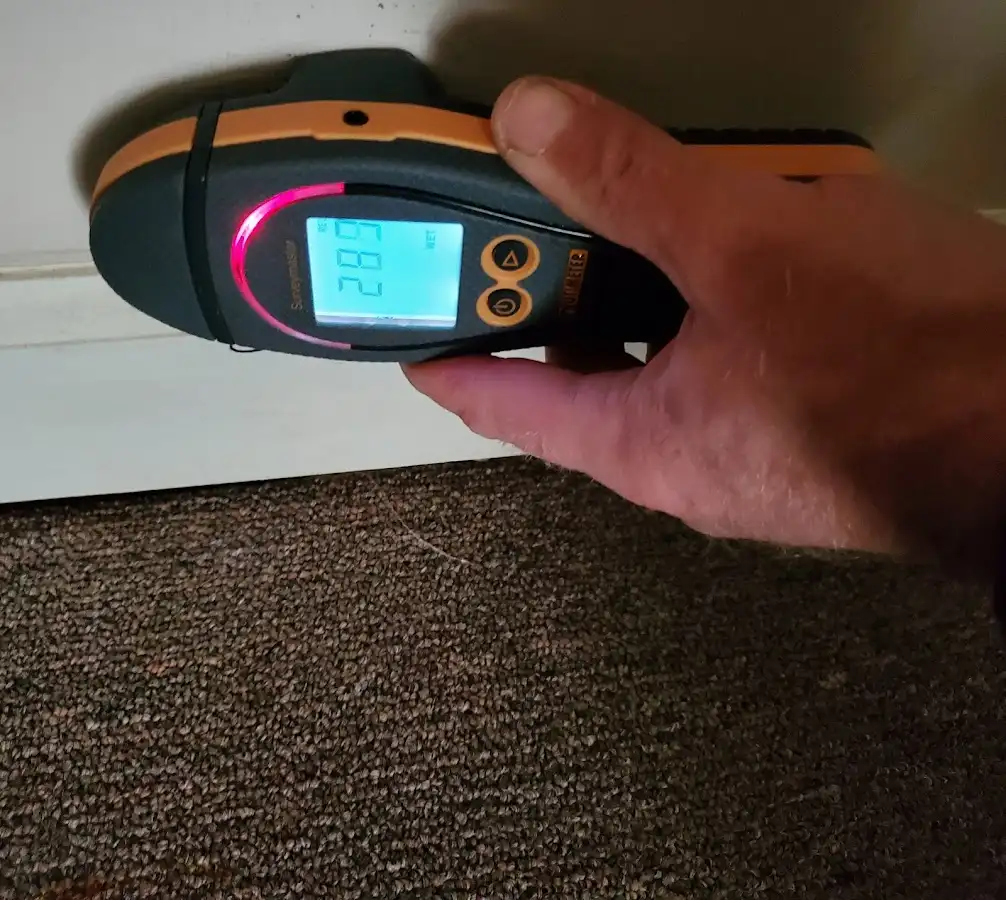Moisture detection at baseboard during Storm Damage Restoration in Beavercreek